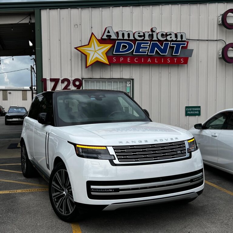 White Range Rover parked outside American Dent Specialists building at 1729, Houston