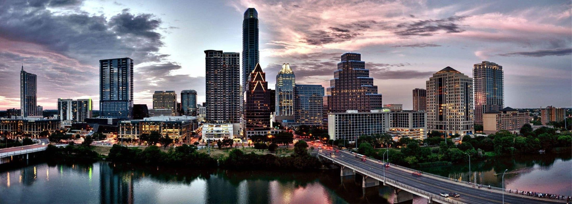 Austin, Texas downtown skyline above Lady Bird Lake at dusk